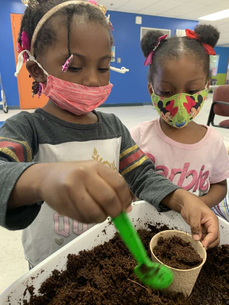 two kids gardening