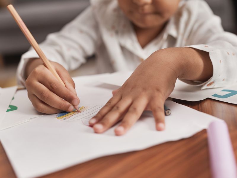 Upper Darby3 kids writing on paper